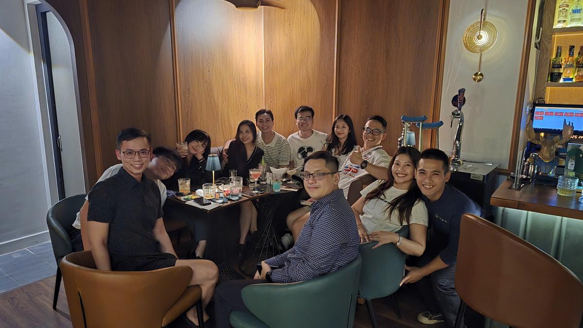 A group of friends celebrating around a table at The 6ix