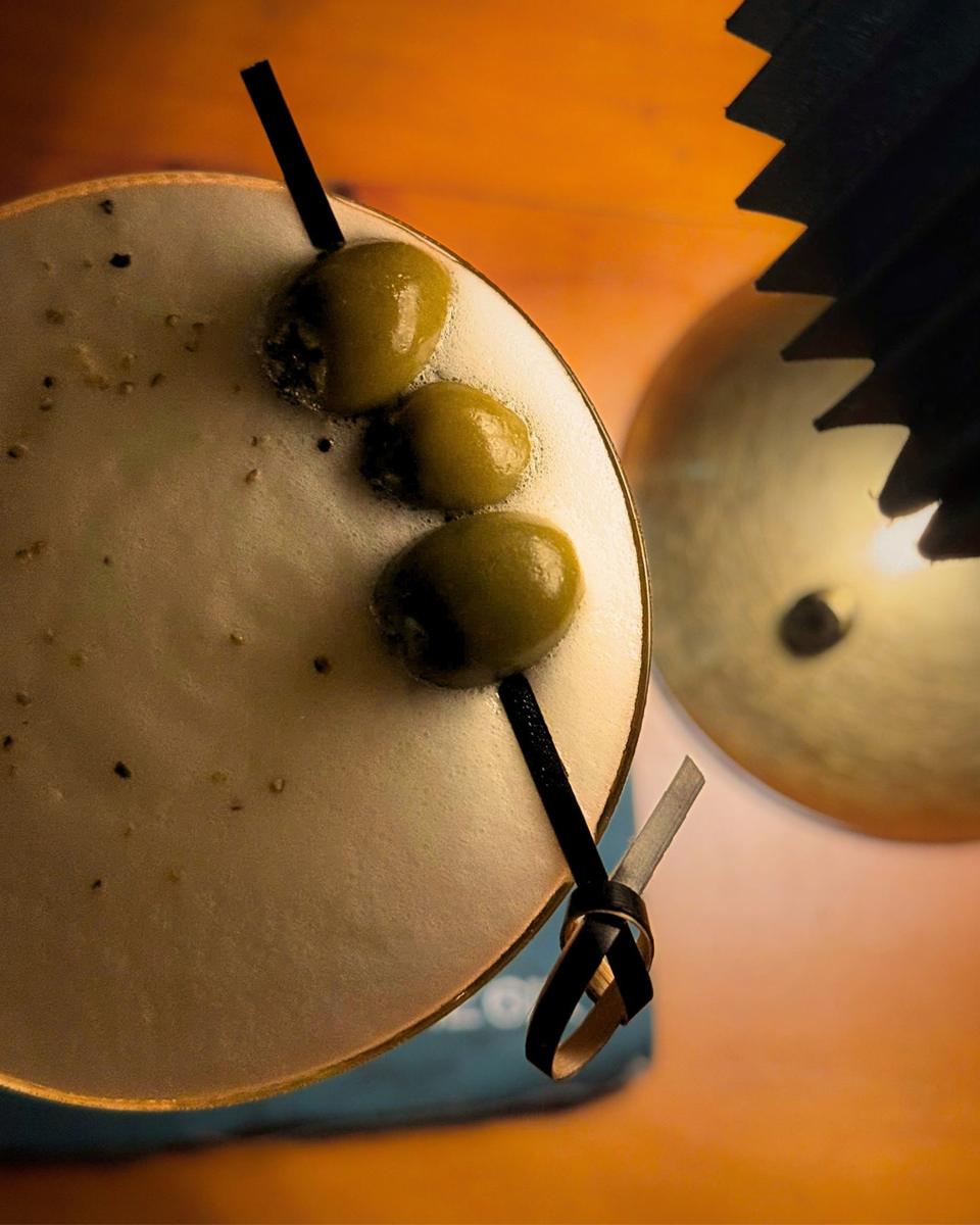 The Cucumber Blossom from above, olives and black pepper on the foam